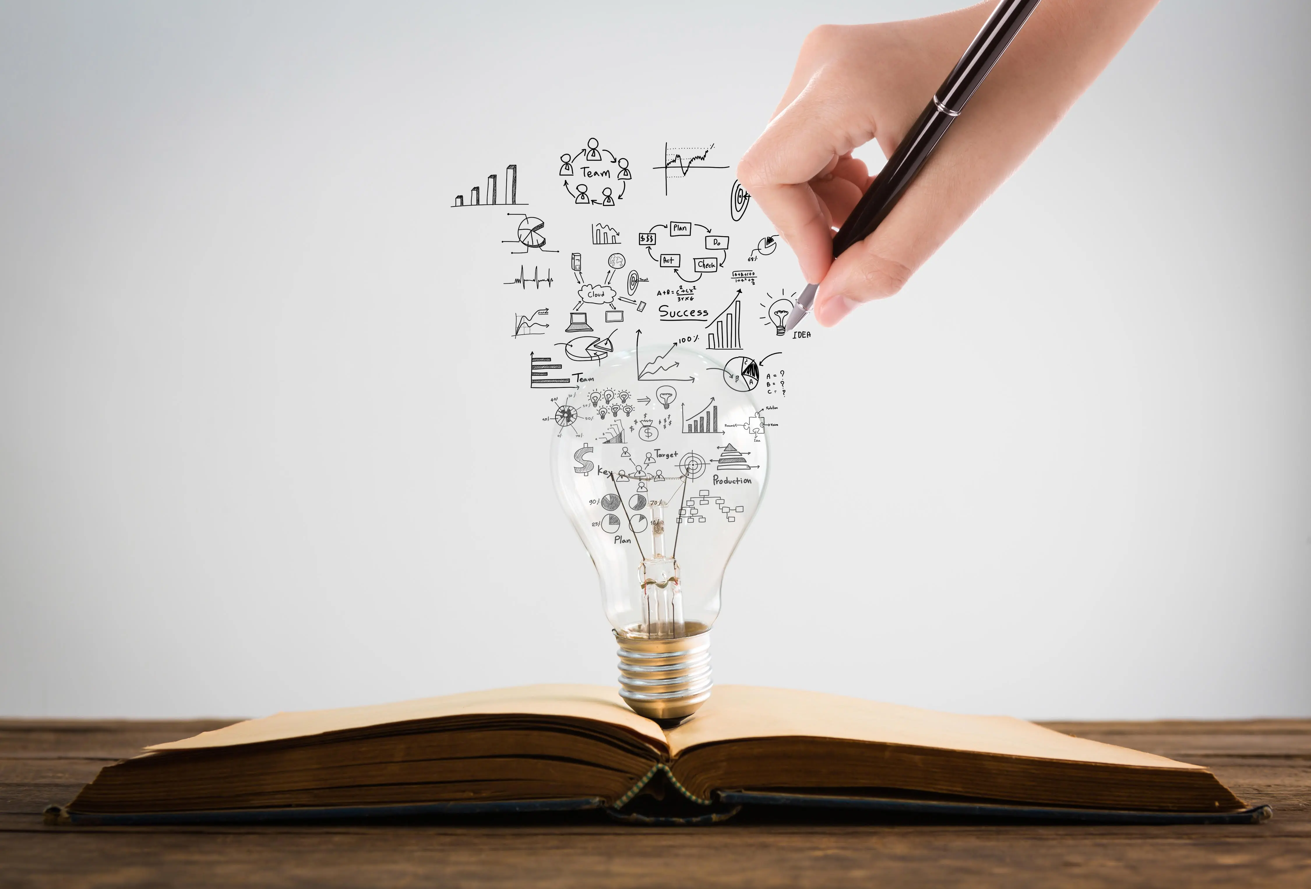 Education - graduation cap, books, laptop and lightbulb